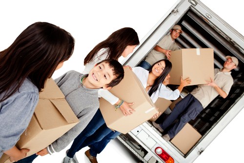 Careful handling of bulky household furniture in an East London property