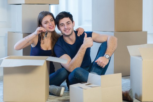 Professional movers loading furniture for a Hackney home relocation