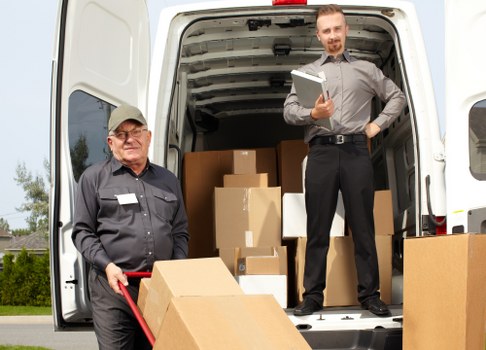 Local house removals team planning a move in Hackney with boxes and equipment