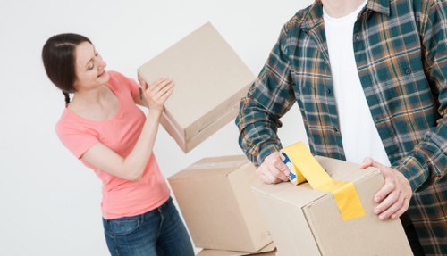 Packed moving boxes and furniture ready for a Hackney house relocation