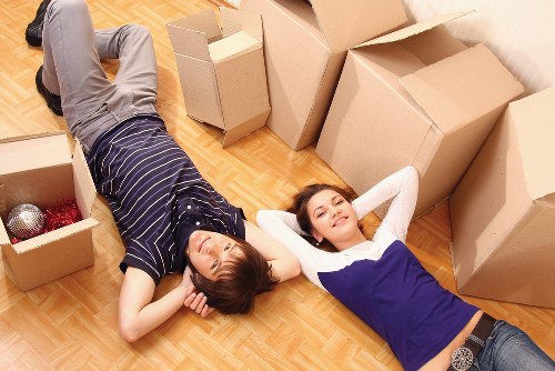 Furniture and boxes being unloaded into a Hackney flat